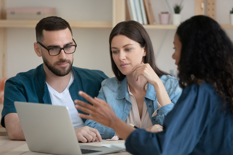 Couple getting advice from mortgage professional