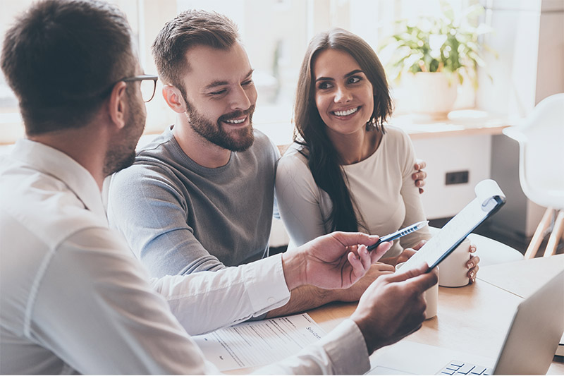 Couple getting advice from mortgage professional