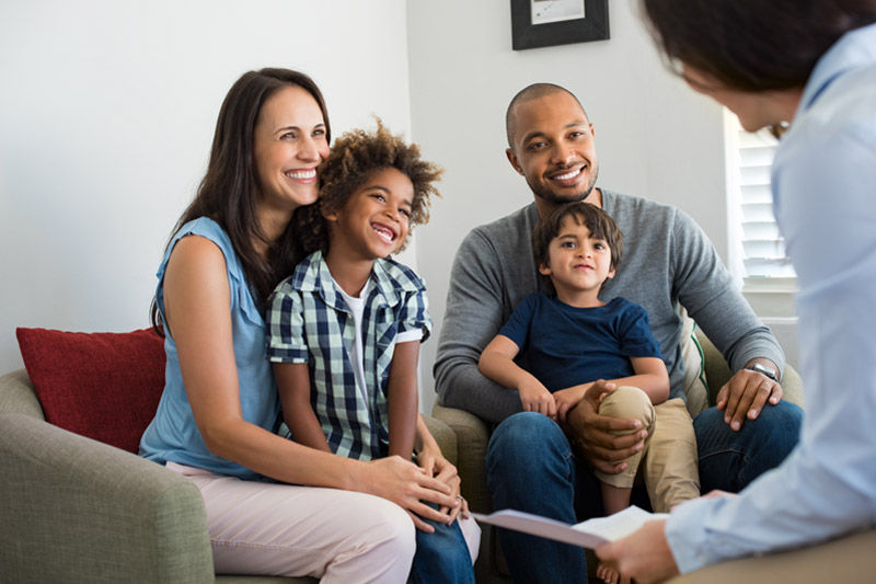 Happy family getting advice from mortgage professional