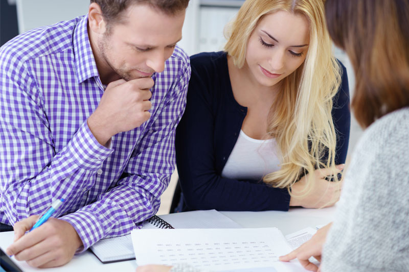 Couple getting advice from mortgage professional